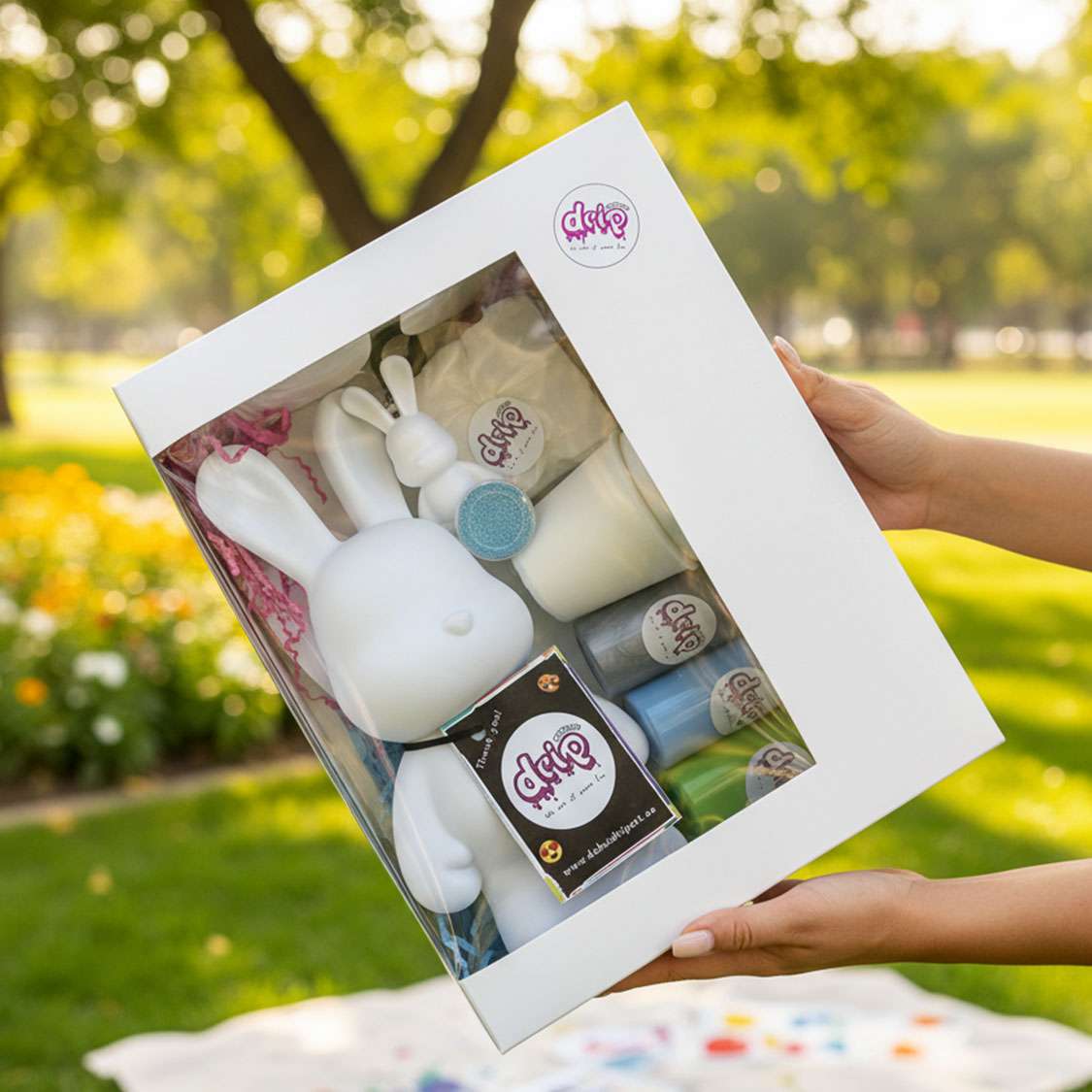 “DubaiDripArt™ Bunny Kit with paints and tools for creating a colorful pour-painted bunny figurine”