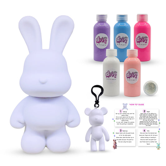 Bunny Piggy Bank Kit – 33 cm “Cotton Candy” DIY acrylic flow set with shimmering silver accent; includes 33 cm bunny piggy-bank figure, five 60 ml acrylic paints (purple, light-blue, fluorescent-pink, white, light-pink), glitter, apron, gloves, table sheet, clear cups, plate, pipette, spoon, and paintbrush—ideal for quick, mess-free creative fun and thoughtful gifting for Ramadan, Eid, birthdays, housewarmings, gender reveals, or baby showers.

