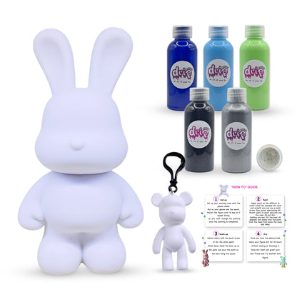 Bunny Piggy Bank Kit – 33 cm “Mystic Ocean” DIY acrylic flow set with shimmering silver accent; includes 33 cm bunny piggy-bank figure, five 60 ml acrylic paints (Dark-Blue, Light-Blue, Green, Black, Silver), glitter, apron, gloves, table sheet, clear cups, plate, pipette, spoon, and paintbrush—for a quick, mess-free creative pour experience and gift-ready fun for Ramadan, Eid, birthdays, housewarmings, gender reveals, or baby showers.
